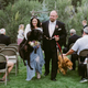 Image for article titled Hero Maid Of Honor Carries Bride's Enormous, Dying Dog Down the Aisle